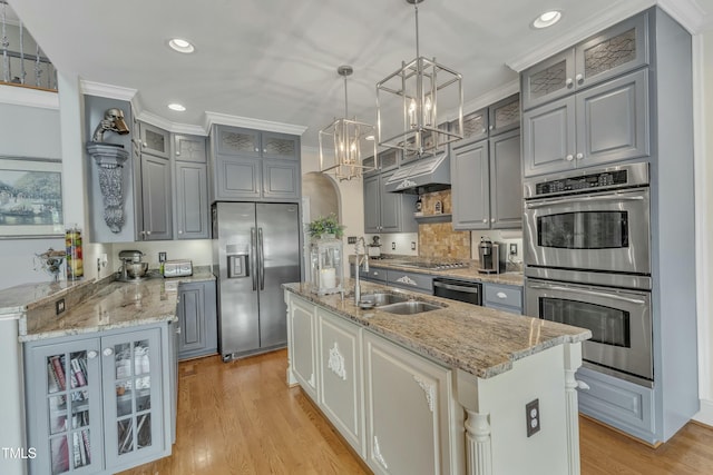 296 Shoreline Dr, Princeton, NC 27569 - kitchen featuring a sink, gray cabinets, under cabinet range hood, a notable chandelier, and appliances with stainless steel finishes