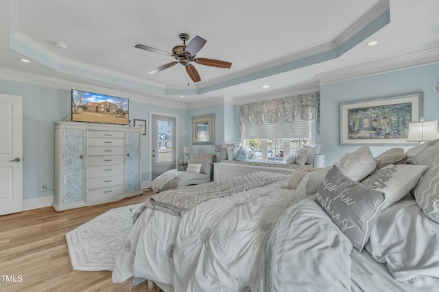 296 Shoreline Dr, Princeton, NC 27569 - bedroom with crown molding, a ceiling fan, light wood-style flooring, and a raised ceiling