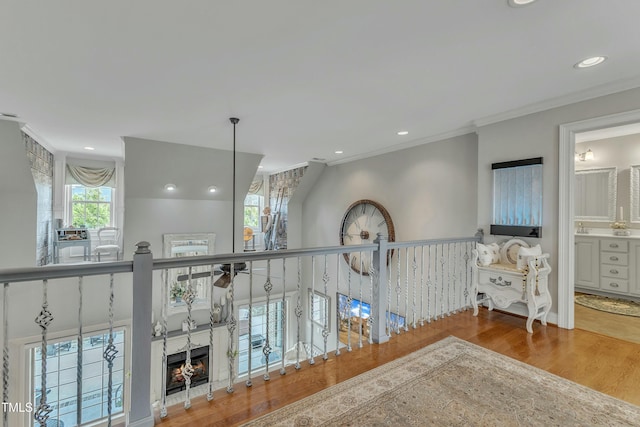 296 Shoreline Dr, Princeton, NC 27569 - corridor with an upstairs landing, wood finished floors, ornamental molding, and recessed lighting