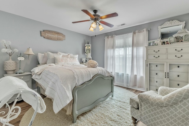 296 Shoreline Dr, Princeton, NC 27569 - bedroom with light wood finished floors, visible vents, and a ceiling fan