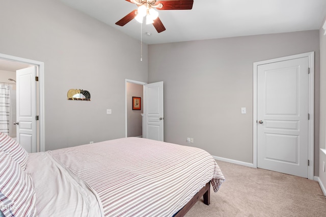 bedroom featuring light colored carpet, baseboards, high vaulted ceiling, and a ceiling fan