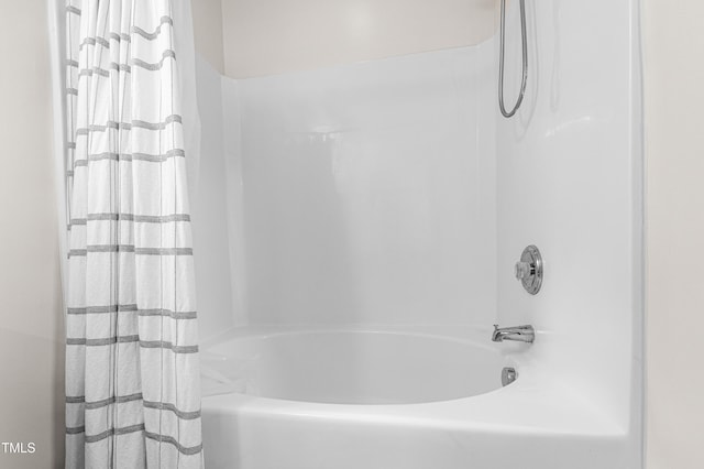 full bath featuring shower / bath combo with shower curtain
