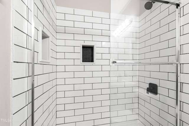 full bathroom featuring a shower stall