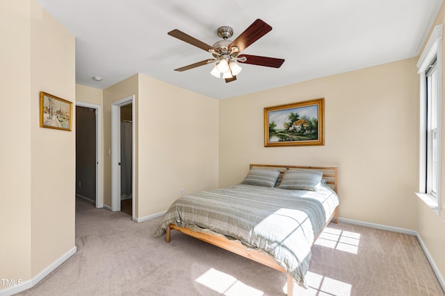 bedroom featuring carpet floors, baseboards, and ceiling fan