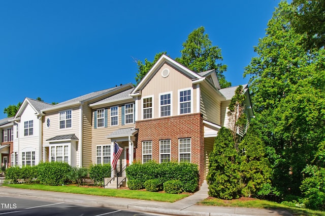view of front of property featuring brick siding