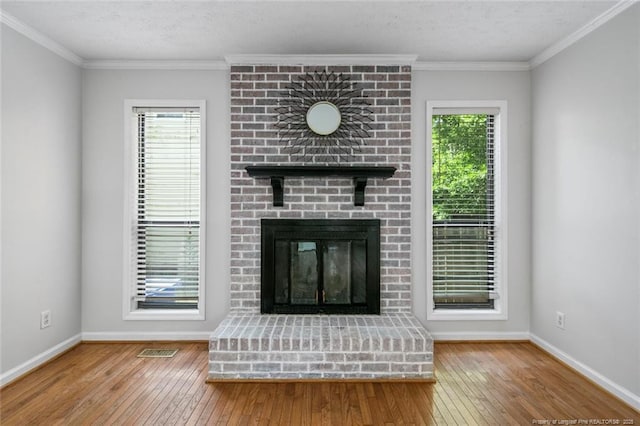 unfurnished living room with baseboards, a fireplace, and wood-type flooring