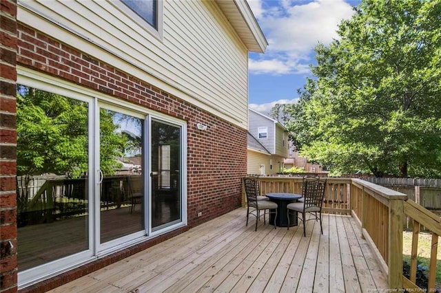 wooden deck with outdoor dining space