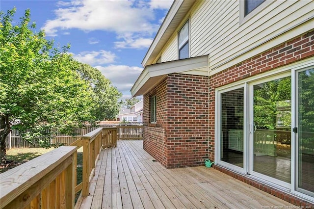 wooden deck featuring fence