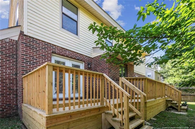 wooden deck featuring stairs