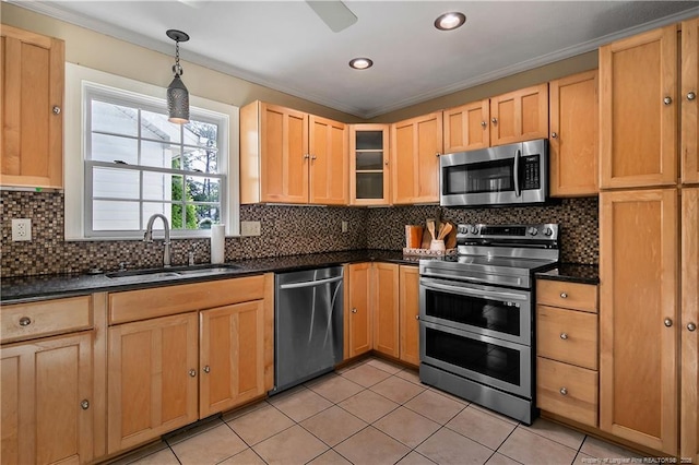 kitchen featuring a sink, stainless steel appliances, ornamental molding, light tile patterned floors, and light brown cabinets
