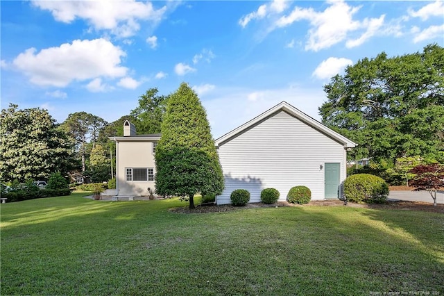 view of home's exterior with a yard