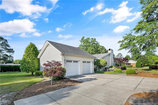 view of property exterior featuring an attached garage, driveway, a chimney, and a lawn