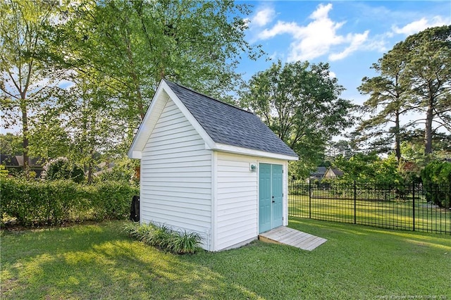 view of shed featuring fence