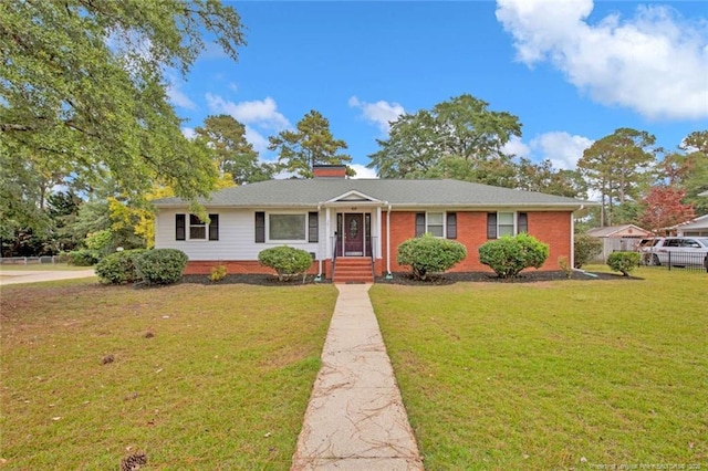 ranch-style home with fence and a front yard