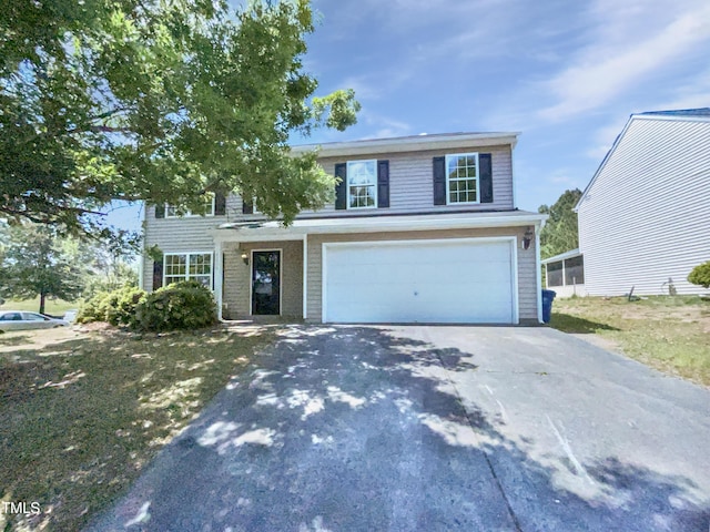 4126 Amber Stone Way, Durham, NC 27704 - traditional-style home with an attached garage and aphalt driveway