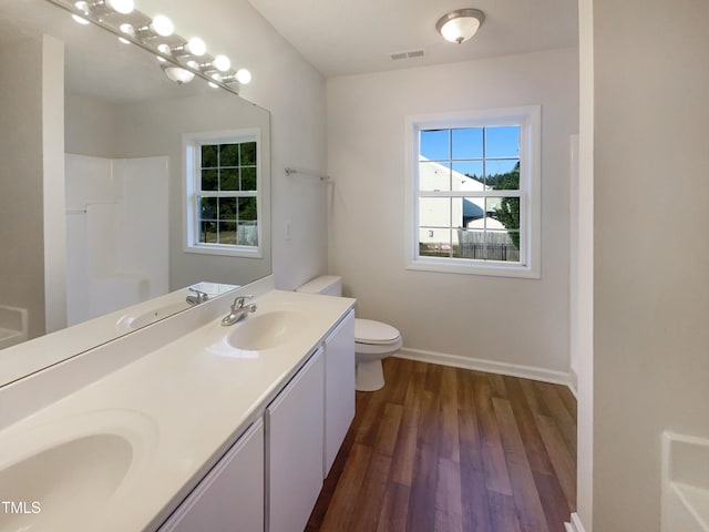 4126 Amber Stone Way, Durham, NC 27704 - full bathroom with a sink, a shower, visible vents, and wood finished floors