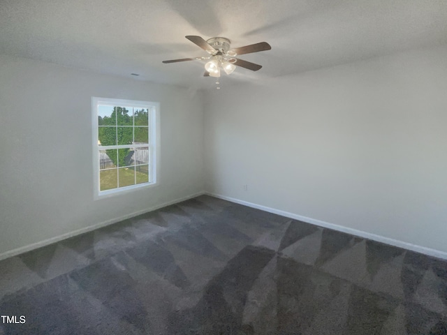 4126 Amber Stone Way, Durham, NC 27704 - empty room with baseboards, a ceiling fan, and dark carpet