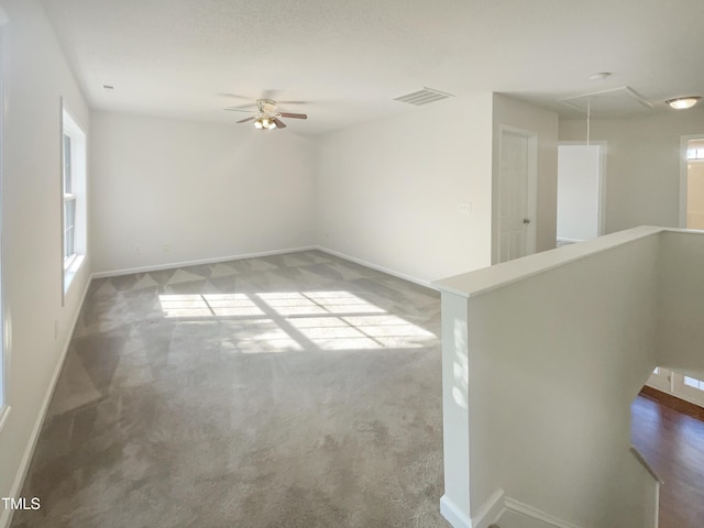 4126 Amber Stone Way, Durham, NC 27704 - spare room featuring attic access, carpet, baseboards, ceiling fan, and visible vents
