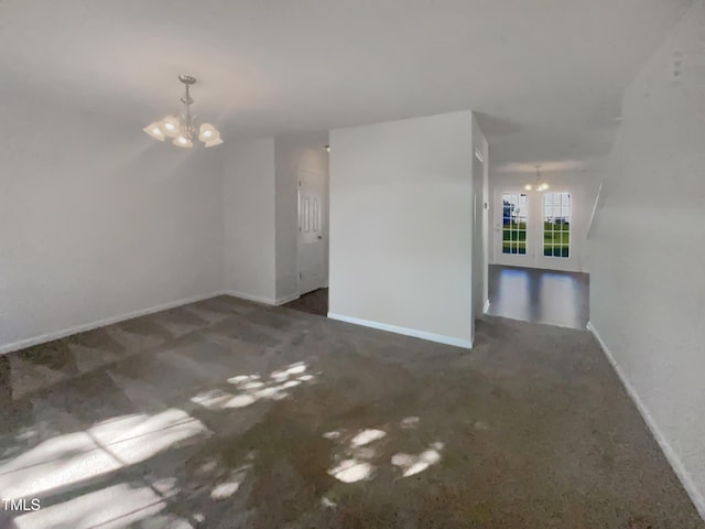 4126 Amber Stone Way, Durham, NC 27704 - carpeted empty room featuring a notable chandelier and baseboards