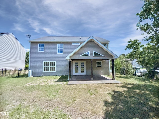 4126 Amber Stone Way, Durham, NC 27704 - back of house featuring a lawn, a patio, french doors, and a fenced backyard