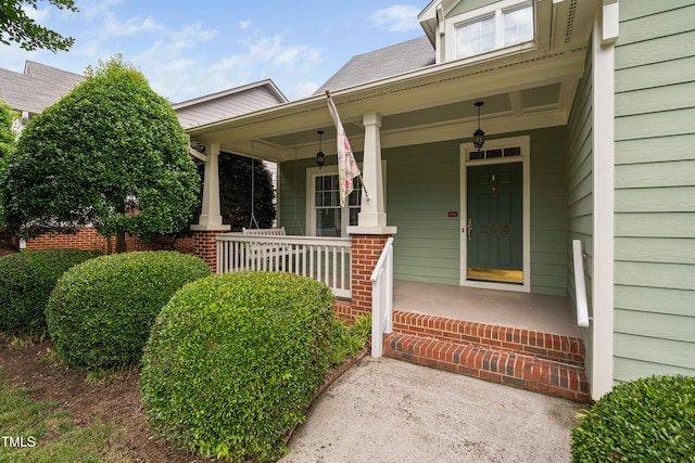 doorway to property featuring a porch