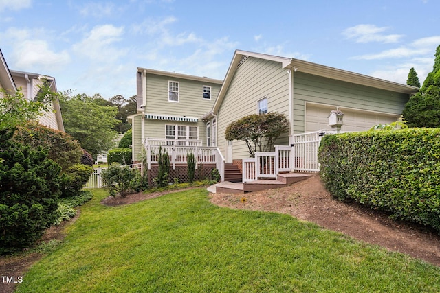 rear view of property featuring a deck