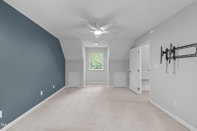 additional living space with vaulted ceiling, ceiling fan, carpet, and baseboards