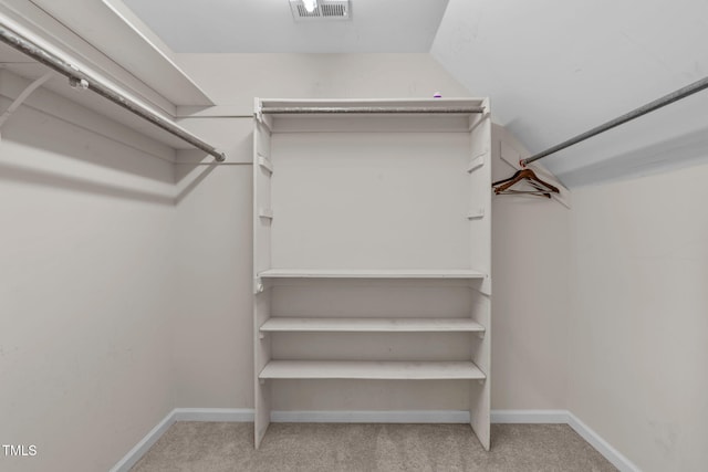 spacious closet with carpet flooring and visible vents