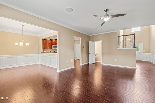 507 Brier Crossings Loop, Durham, NC 27703 - unfurnished living room with a chandelier, dark wood finished floors, ceiling fan, and crown molding