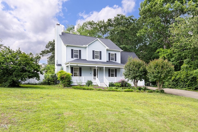 59 Troy Dr, Fuquay Varina, NC 27526 - view of front of property with covered porch, a chimney, and a front lawn