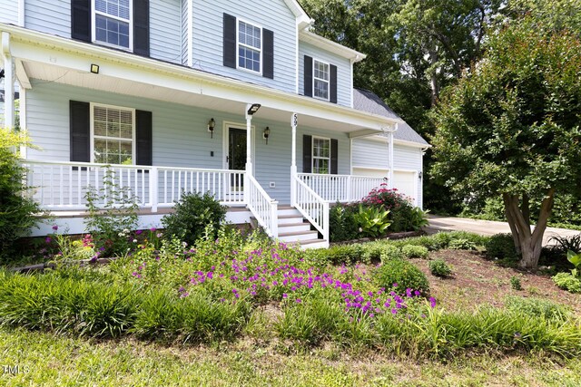 59 Troy Dr, Fuquay Varina, NC 27526 - view of front of home featuring covered porch and an attached garage