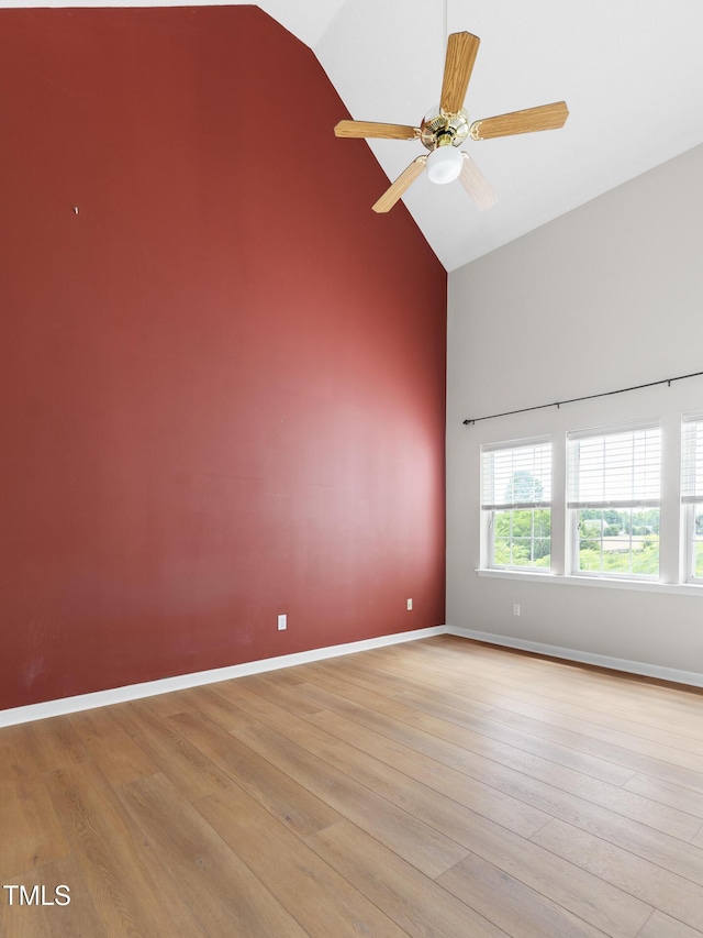 59 Troy Dr, Fuquay Varina, NC 27526 - empty room with high vaulted ceiling, light wood-style floors, ceiling fan, and baseboards