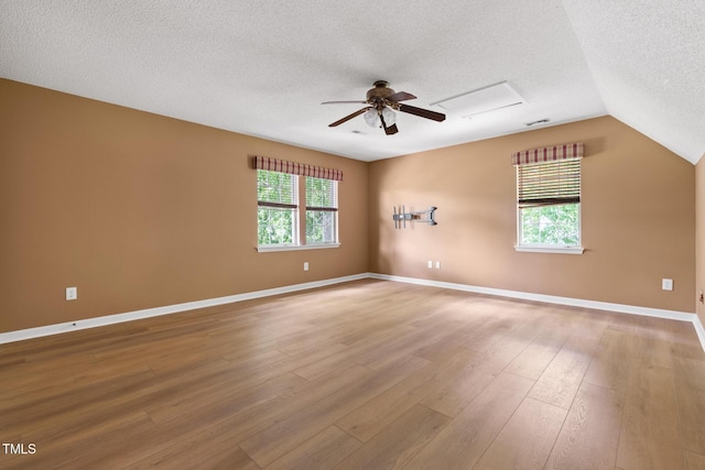 59 Troy Dr, Fuquay Varina, NC 27526 - unfurnished room featuring a textured ceiling, a ceiling fan, wood finished floors, lofted ceiling, and baseboards