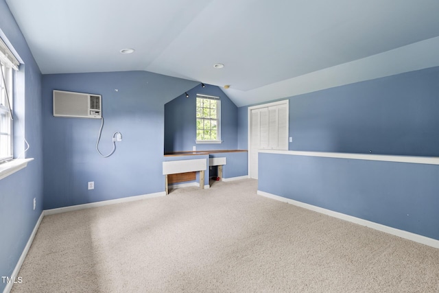 59 Troy Dr, Fuquay Varina, NC 27526 - bonus room with a wall mounted air conditioner, vaulted ceiling, baseboards, and carpet