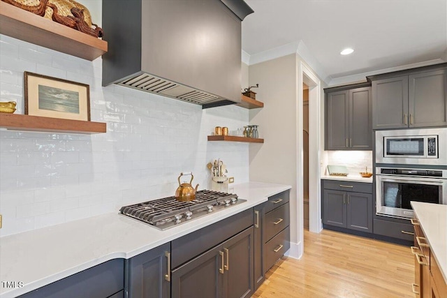 kitchen featuring appliances with stainless steel finishes, open shelves, custom exhaust hood, decorative backsplash, and recessed lighting