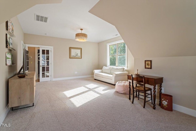living area featuring carpet flooring, baseboards, lofted ceiling, and french doors