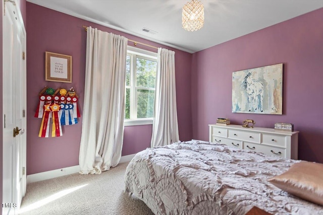 bedroom with carpet floors and baseboards