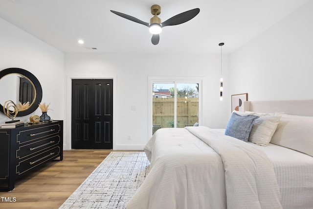 bedroom with access to outside, light wood finished floors, recessed lighting, and ceiling fan