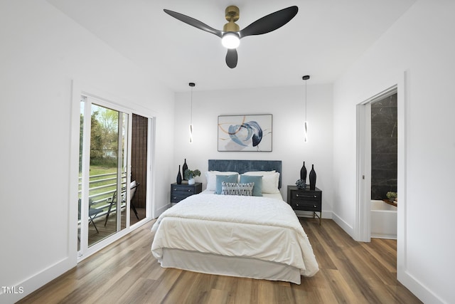 bedroom featuring access to outside, wood finished floors, baseboards, and a ceiling fan