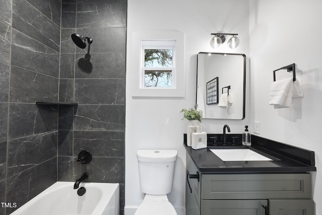 full bathroom with vanity, toilet, and  shower combination