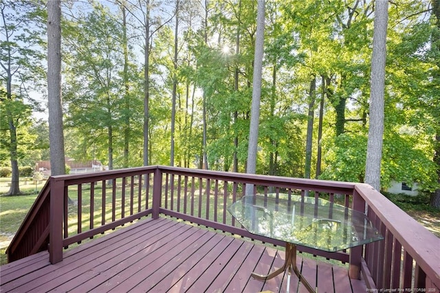 wooden terrace with outdoor dining space