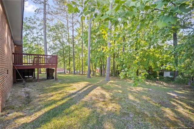view of yard featuring a wooden deck
