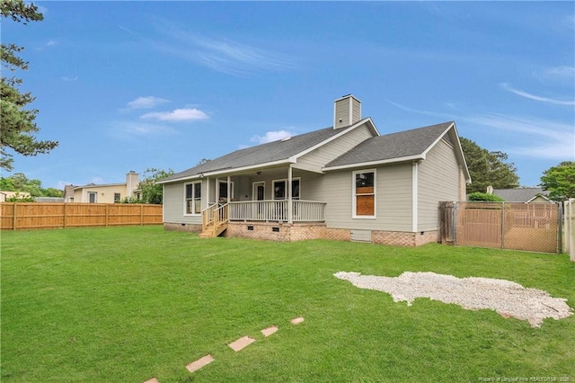 back of house featuring a yard, a fenced backyard, and crawl space