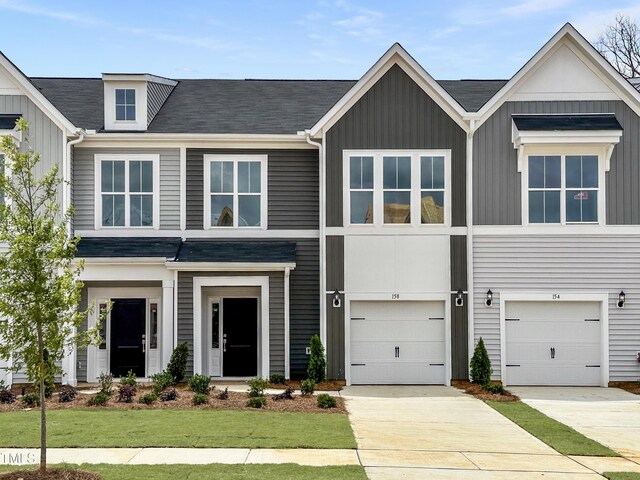 158 Ripple Way Unit 321, Clayton, NC 27520 - view of front of property featuring board and batten siding, a front yard, and driveway