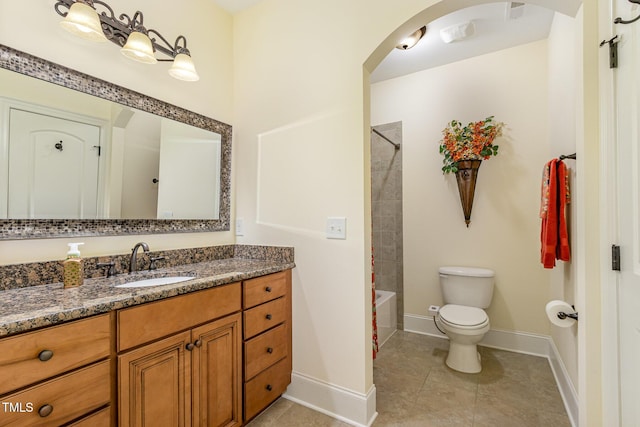 full bath featuring baseboards, vanity, toilet, and tile patterned flooring