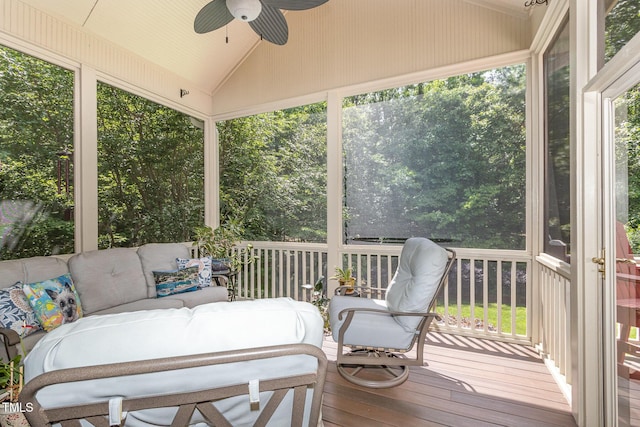 sunroom / solarium with a ceiling fan, vaulted ceiling, and an outdoor hangout area