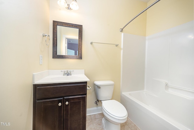 bathroom with toilet, baseboards, vanity, tile patterned floors, and shower / bathtub combination
