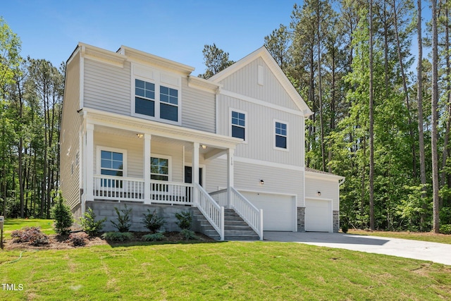 view of front of house featuring covered porch, a garage, concrete driveway, and a front lawn