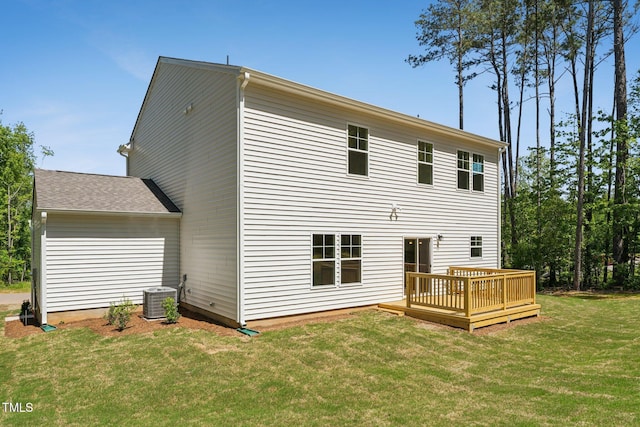 rear view of property featuring a wooden deck, central AC unit, and a lawn