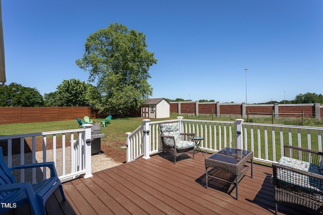 deck featuring a storage shed and an outdoor structure